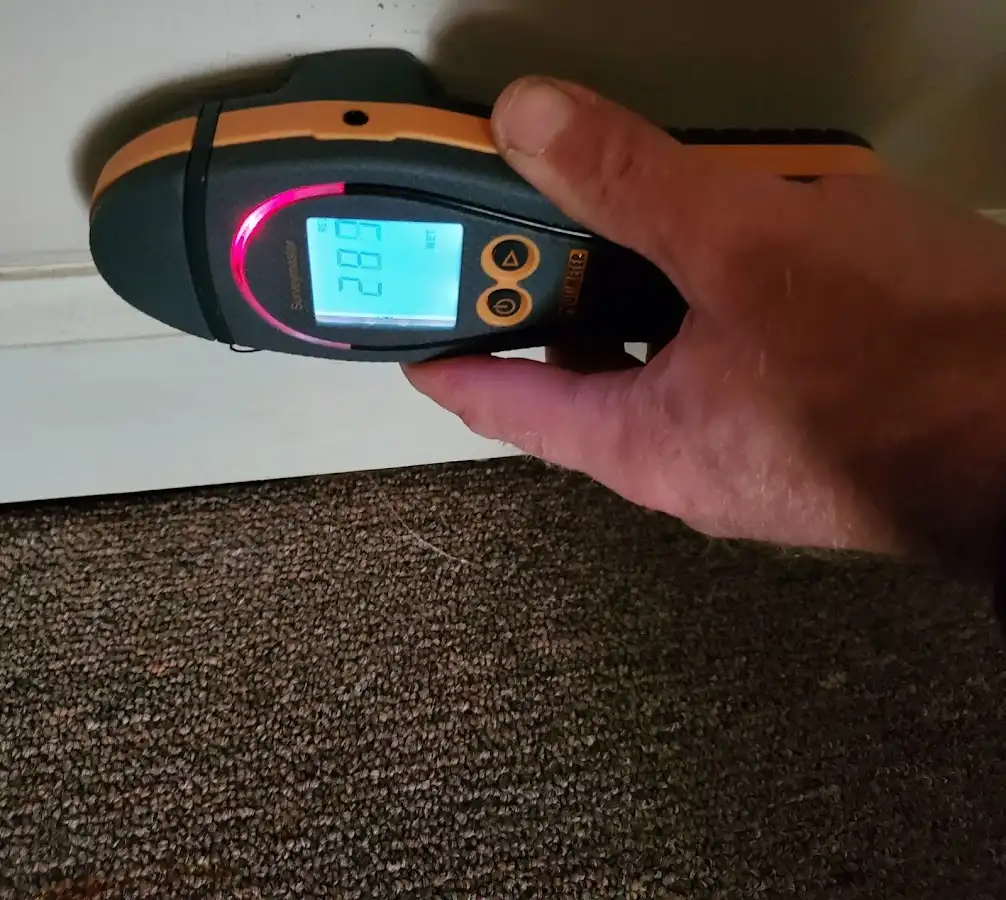 Moisture detection at baseboard during Storm Damage Restoration in Park Ridge